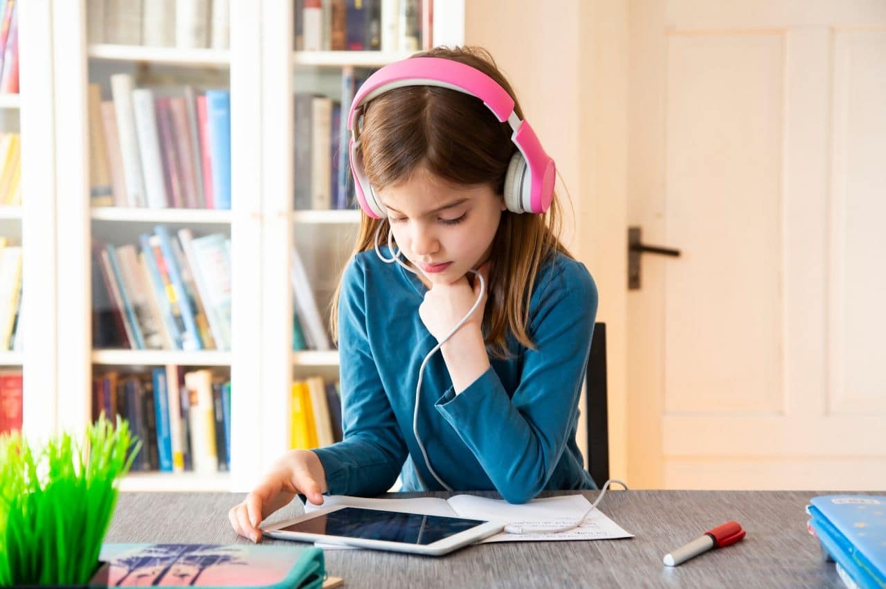 Challenges of Distance Learning - girl on headphones